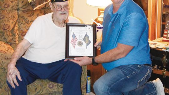 Cox receives pin, certificate for 50 years